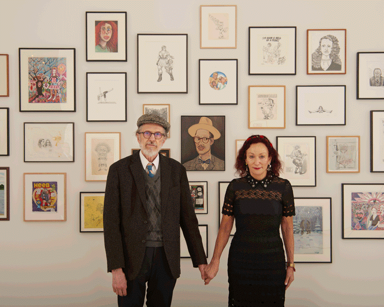 Animated gif of R. Crumb and Aline Kominsky-Crumb holding hands in front of their works on view in the exhibition Aline Kominsky-Crumb & R. Crumb: Drawn Together at 525 West 19th Street in New York, dated 2017.