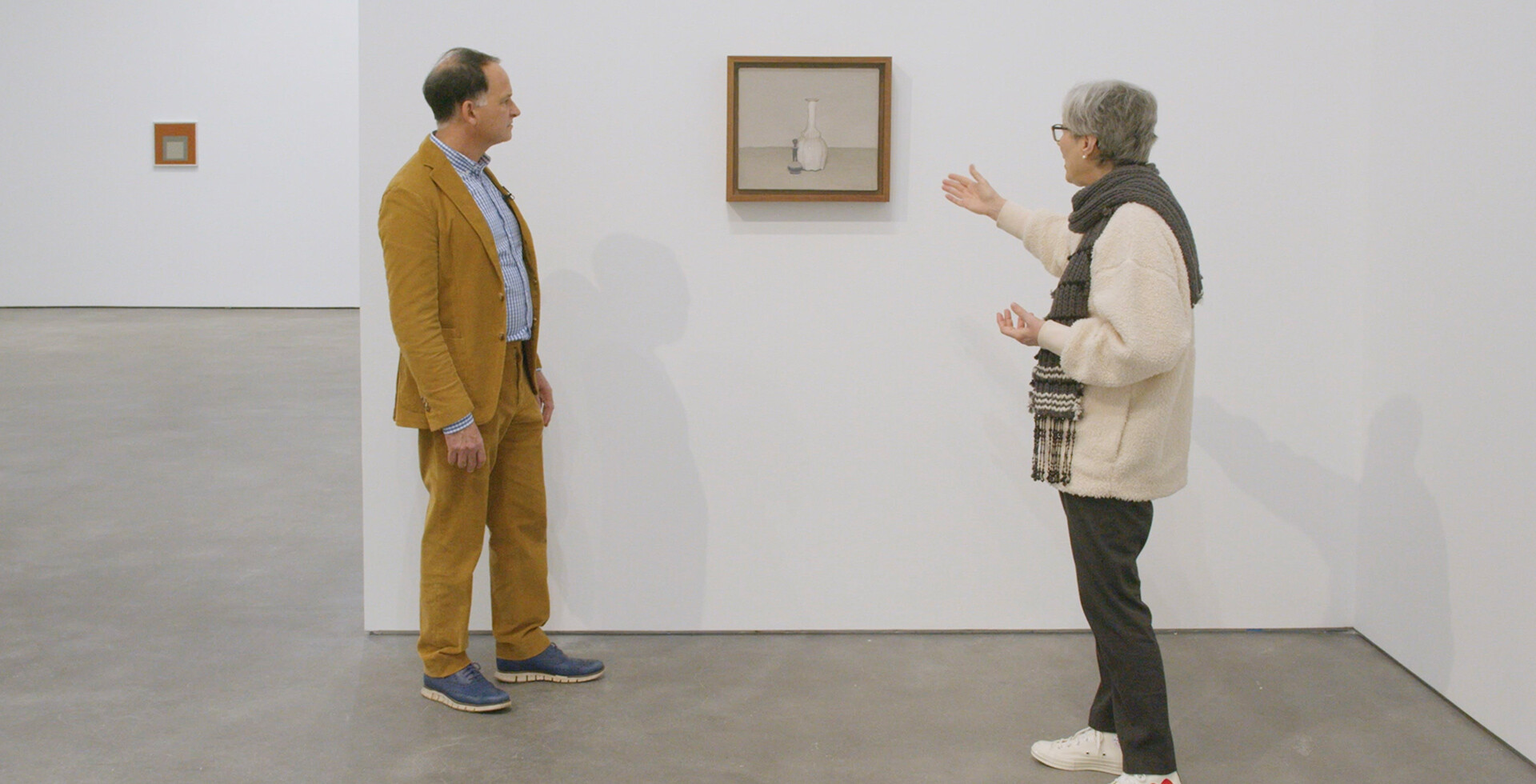 A photo of David Leiber (left) and Laura Mattioli in the exhibition Albers and Morandi: Never Finished, at David Zwirner, New York, in 2021.