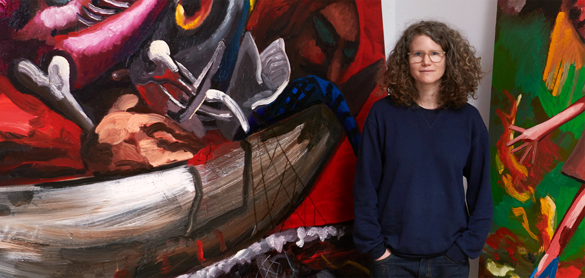 A photo of Dana Schutz and her painting The Fisherman, dated 2021.