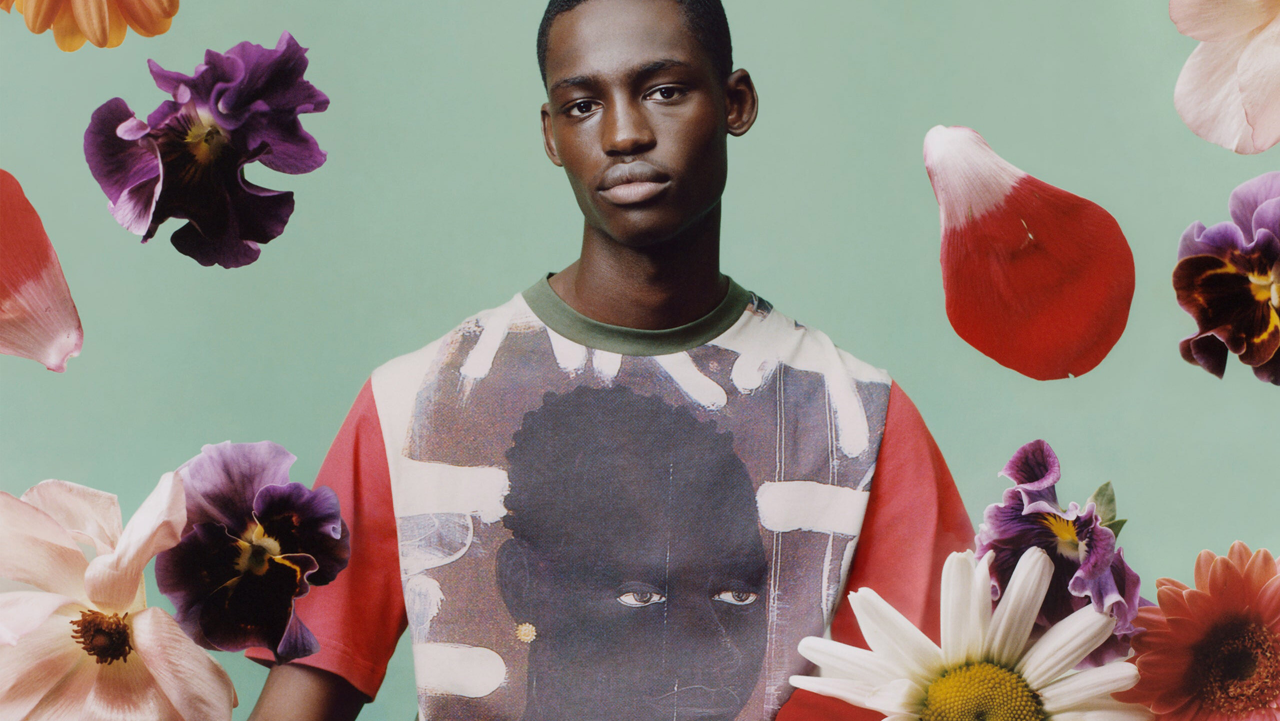A detail of a photograph by Tyler Mitchell of Wales Bonner and Kerry James Marshall’s limited edition capsule collection, featuring a T-shirt with a detail from Marshall’s 1993 painting Lost Boys: AKA Black Sonny, dated 2022.