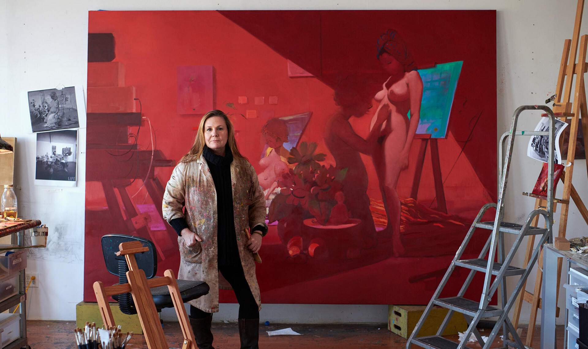A detail of a photo of Lisa Yuskavage in her Brooklyn studio, standing in front of a work in progress, in 2020. The photo is by Jason Schmidt.