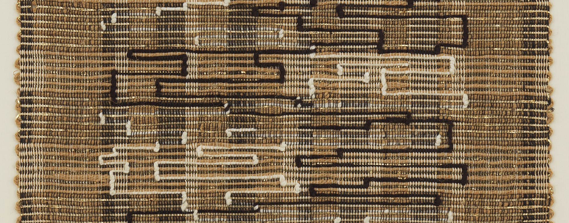 A detail from a textile by Anni Albers, titled Black-White-Gold I,	dated 1950.