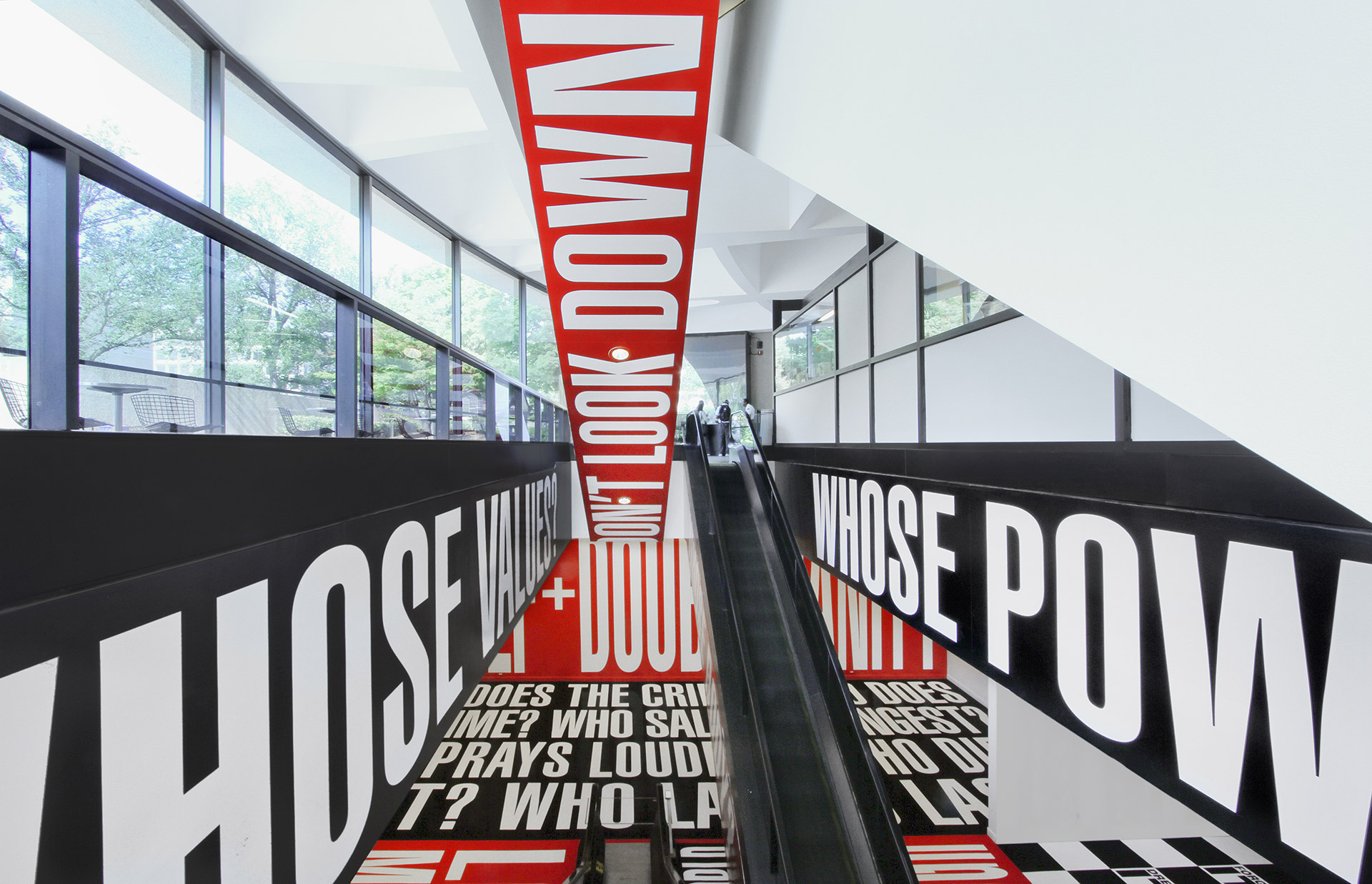 An installation view of an exhibition titled, Barbara Kruger: Belief + Doubt, at the Hirshhorn Museum and Sculpture Garden, Washington, DC, dated 2012-ongoing.