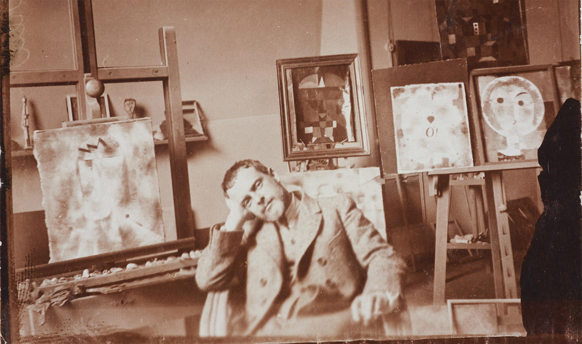 A photo of Paul Klee in his studio at the Bauhaus in Weimar, dated 1923.