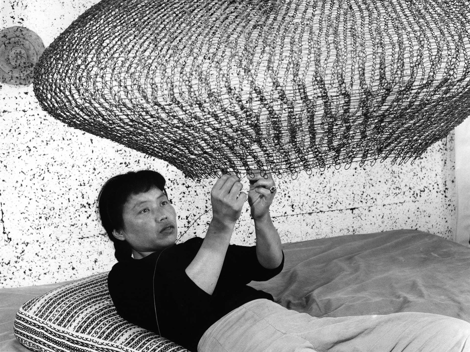 A photograph of Ruth Asawa by Imogen Cunningham, dated 1957.